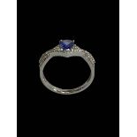 18 carat white gold, tanzanite and diamond fancy design ring, size P.