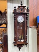 Gustav Becker Victorian walnut cased double weight Vienna wall clock having enamelled dial.