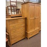 Contemporary light oak two door wardrobe with base drawer,