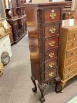 Polished and carved mahogany six drawer CD chest on ball and claw legs, 141.5cm by 40cm by 32cm.