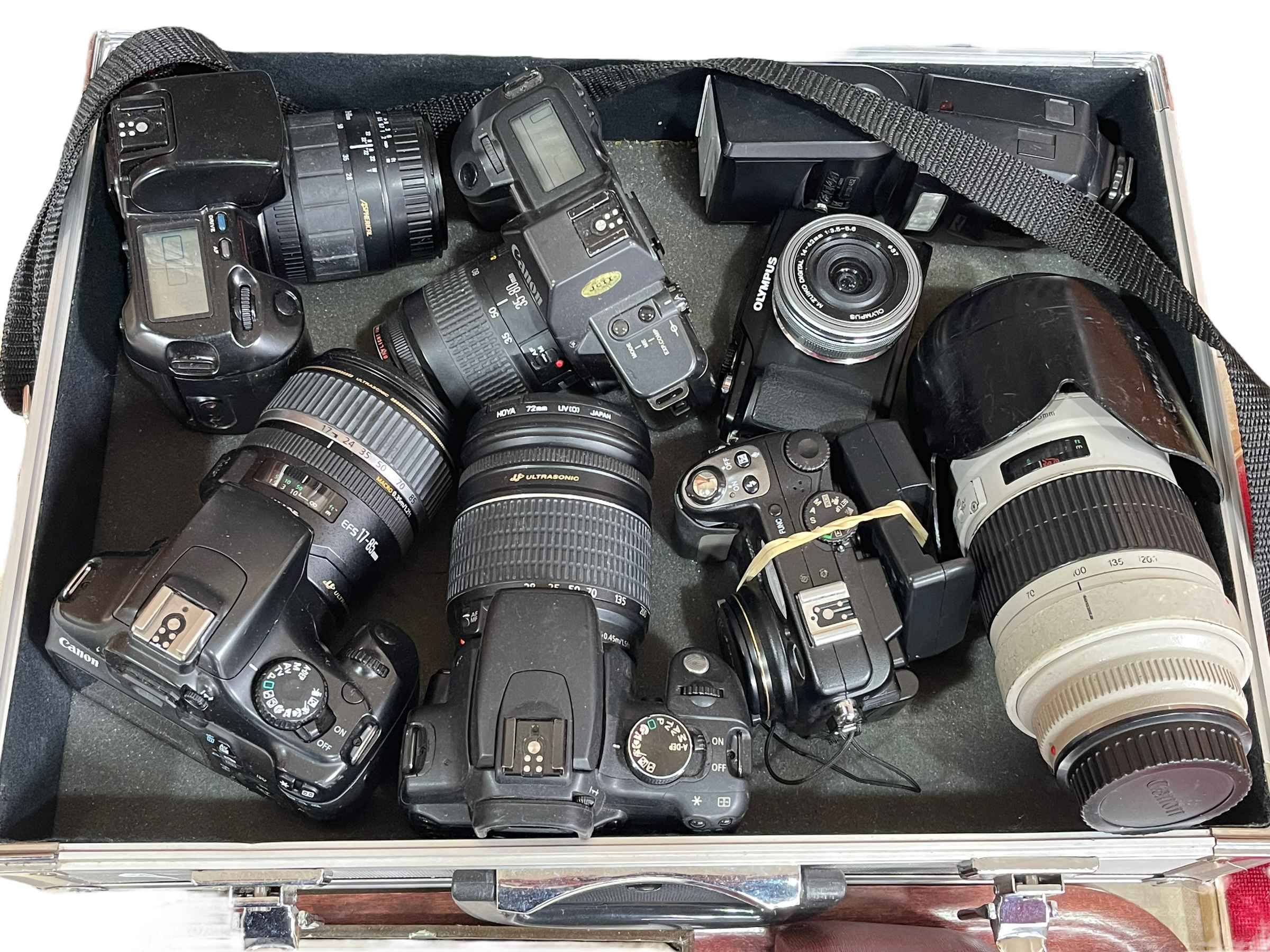 Aluminium flight case containing selection of cameras including Canon 1100D, EOS 350D, Nikon,