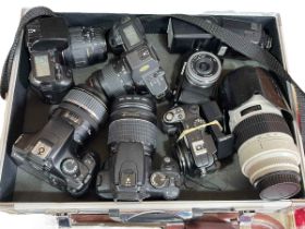 Aluminium flight case containing selection of cameras including Canon 1100D, EOS 350D, Nikon,