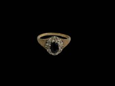 Sapphire and diamond 9 carat gold ring, size K.