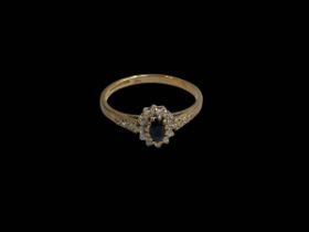 Sapphire and diamond 9 carat gold ring, size O.