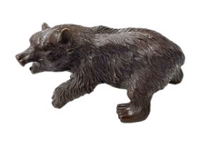 Cast metal/bronze bear.