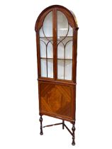 Edwardian mahogany and ebony line inlaid corner cabinet having two arched glazed panel doors above