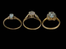 Three 9 carat gold gem set rings.