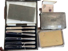 Silver cigarette case, two silver photograph frames, silver handled knives, spoons and cufflinks.