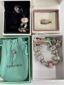 Pandora bracelet and charms and a silver pendant.