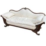Regency style carved mahogany framed sofa in light classical fabric.