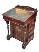 Late Victorian inlaid rosewood Davenport having concealed stationery compartments and leather