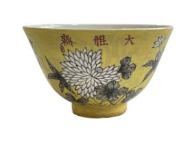 Chinese yellow tea bowl decorated with birds and floral design, four character mark to base.