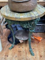 Rams head cast base circular pub table, 75cm by 61cm diameter.