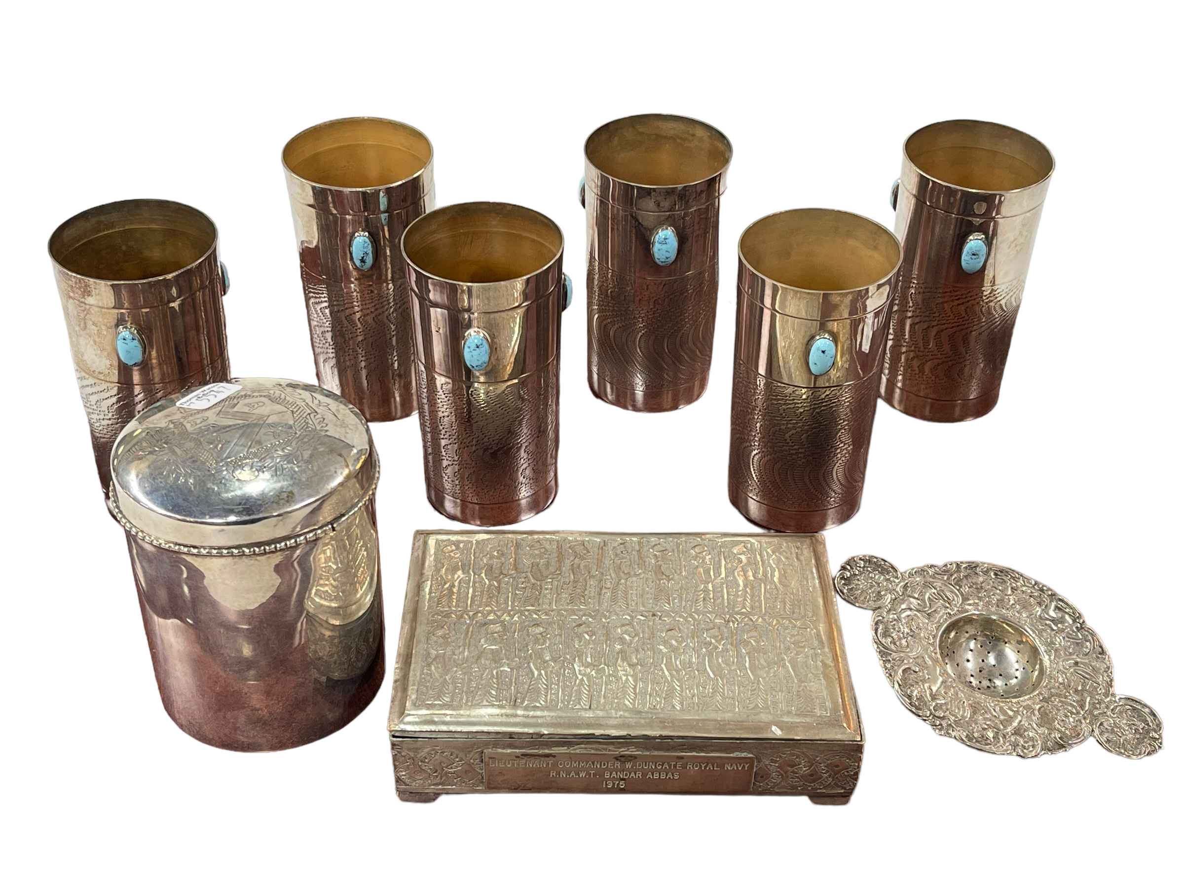 Set of six metal beakers, two boxes and tea strainer.