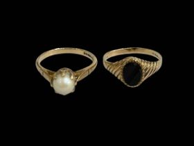 Two 9 carat gold pearl and agate rings.
