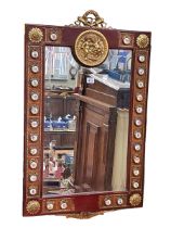 Continental rectangular bevelled wall mirror, the frame with applied roundel and putti decoration,