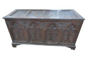 Antique carved oak four panel front coffer, 68cm by 128cm by 53cm.