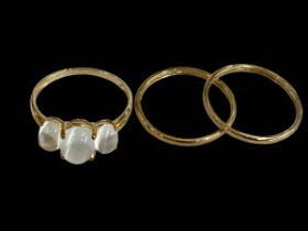 Two 9 carat gold thin band rings and moonstone ring.