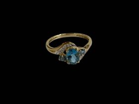 9 carat gold blue three stone and diamond set ring, size U.