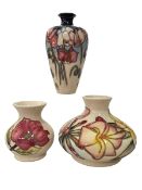 Three Moorcroft Pottery vases, including Frangipani and Magnolia, tallest 16cm.