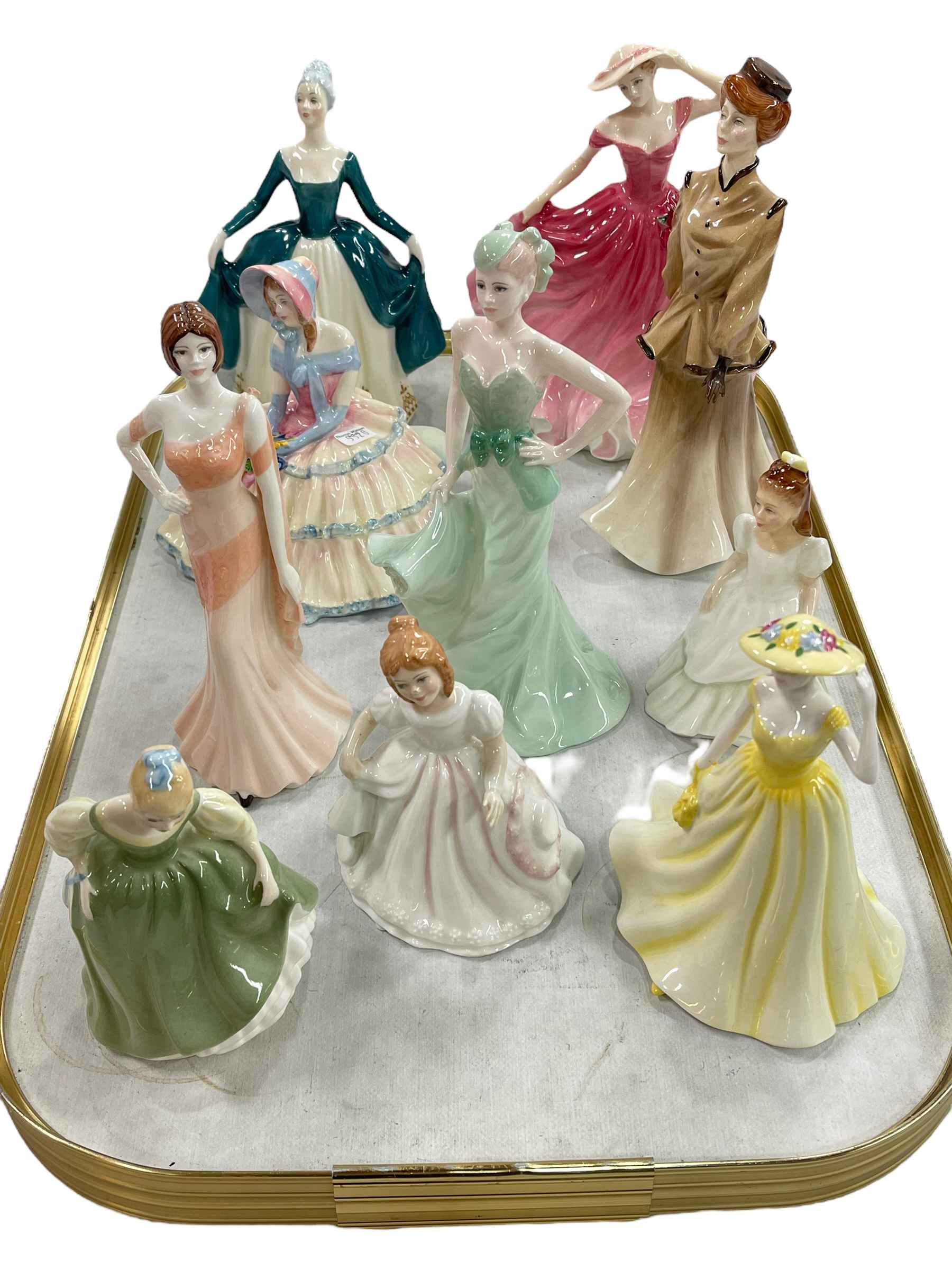 Eight Royal Doulton and two Coalport ladies.