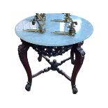 Circular marble topped centre table on carved polished wood base, 76.5cm by 86cm diameter.