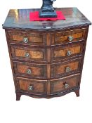 Antique mahogany crossbanded and ebony line inlaid four drawer bow front chest on splayed bracket