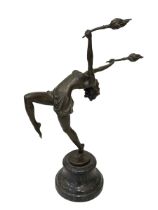 Art Deco style bronze figure of a dancer holding torches aloft on marble base.