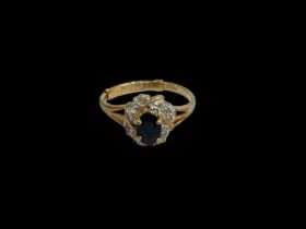 Sapphire and diamond fancy setting 9 carat gold ring, size R.