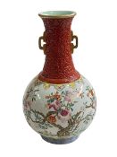 Chinese famille rose vase decorated with trees, iron red neck and gilt handled,