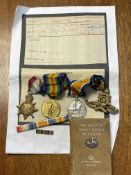 Trio of WWI medals named to 5977 DVR. C. Motley R. A, together with cap badge and French dictionary.