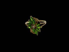 9 carat gold tiny diamond and green stone petals ring, size U.