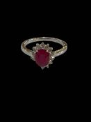 18 carat white gold, ruby and diamond cluster ring, size O, ruby 1.93 and diamonds 0.29 carats.