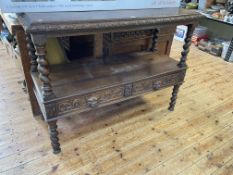 Victorian carved oak two tier dumb waiter having twist supports and two drawers with carved lion