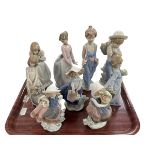 Nine Lladro figures including Spring is Here, School Days, Flower Harvest and Pocket Full of Wishes.