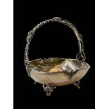 Sterling silver bon bon basket with ornate handle and feet, 13.5cm across.