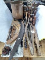 Boomerangs, three canoe models, wood carvings, etc.