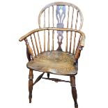 Windsor pierced splat back elbow chair.