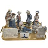 Three Lladro Clowns, four Boy Figures and three Advert Signs including Pals Forever,