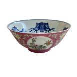 Chinese famille rose decorated bowl with blue and white interior decoration,