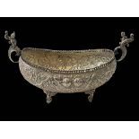 Continental 900 silver bowl with embossed decoration and cherub adorned handles, 27cm across.