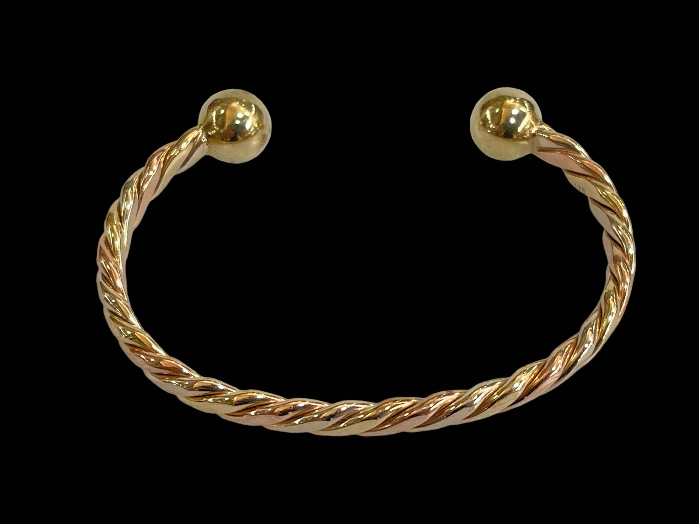 9 carat gold rope twist solid bangle.