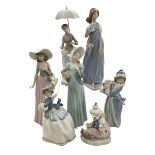 Seven Lladro figures including Zaphir Lady, Christmas Time and Clown.