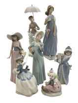 Seven Lladro figures including Zaphir Lady, Christmas Time and Clown.