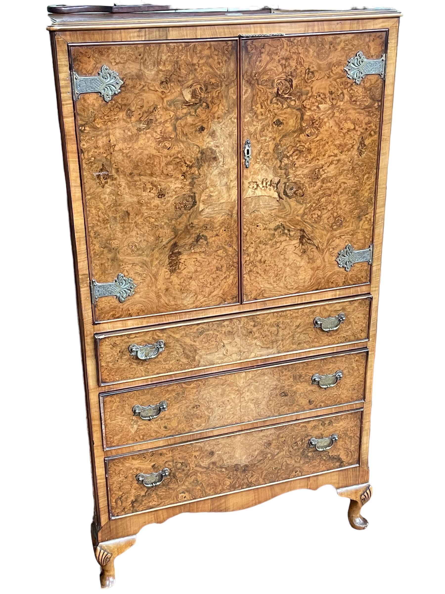 Burr walnut linen cupboard having two doors above three drawers on cabriole legs,