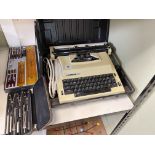 Vintage Hermes 505 electric typewriter, cased drawing instruments and writing set.