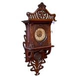 Art Nouveau oak cased wall clock having brass and enamelled dial.