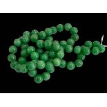 Green jade bead necklace, 80cm length.