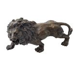 Hollow bronze/spelter lion, 29cm length.