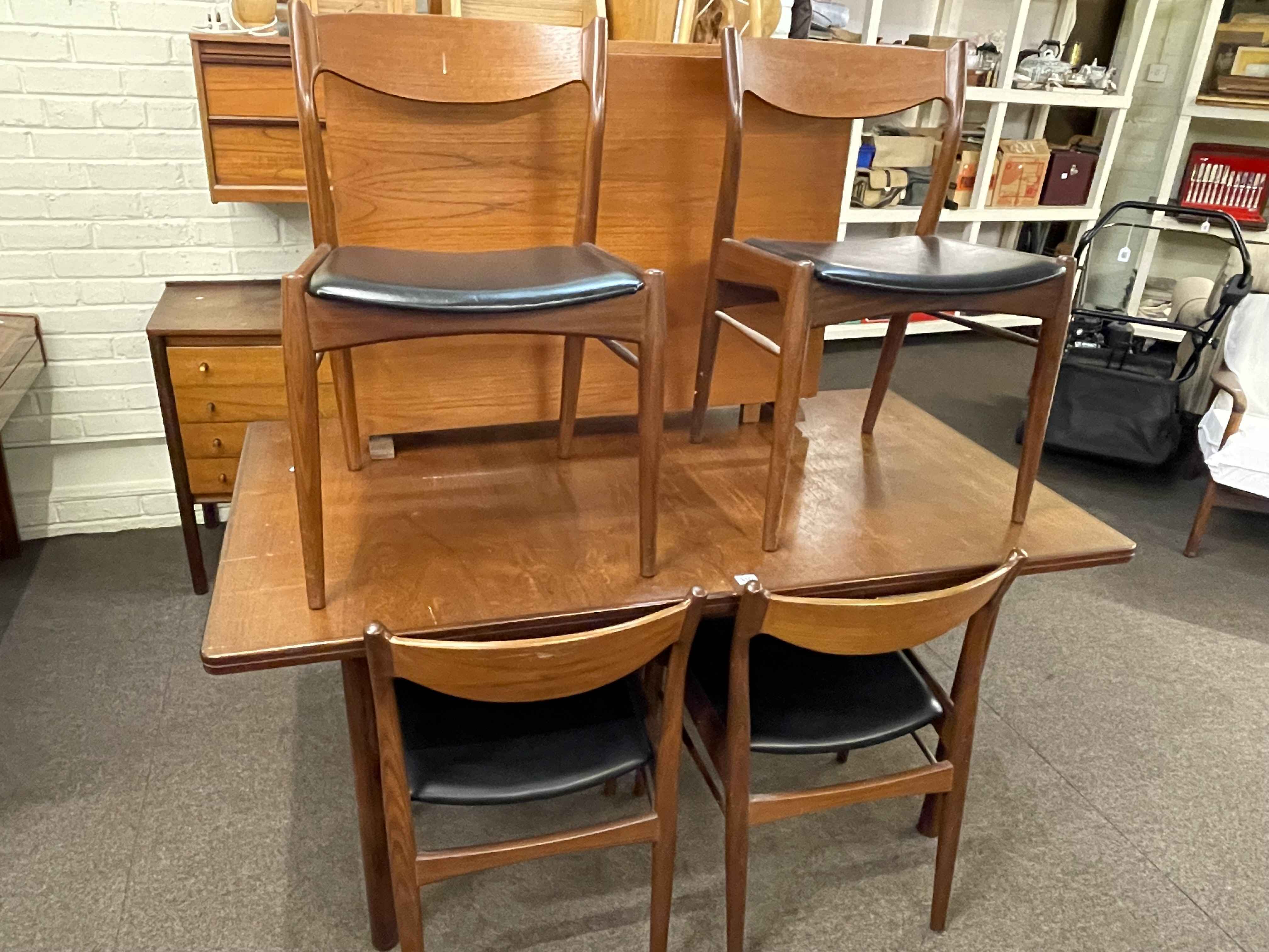 Mid Century teak extending dining table and six chairs, teak drop leaf table,